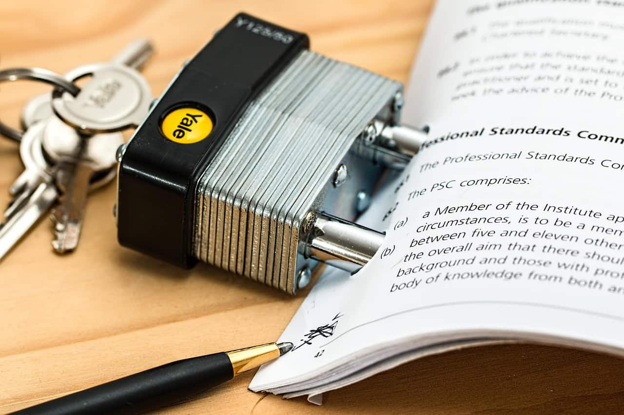Legal documents and a padlock symbolizing probate and inheritance disputes over estate assets.